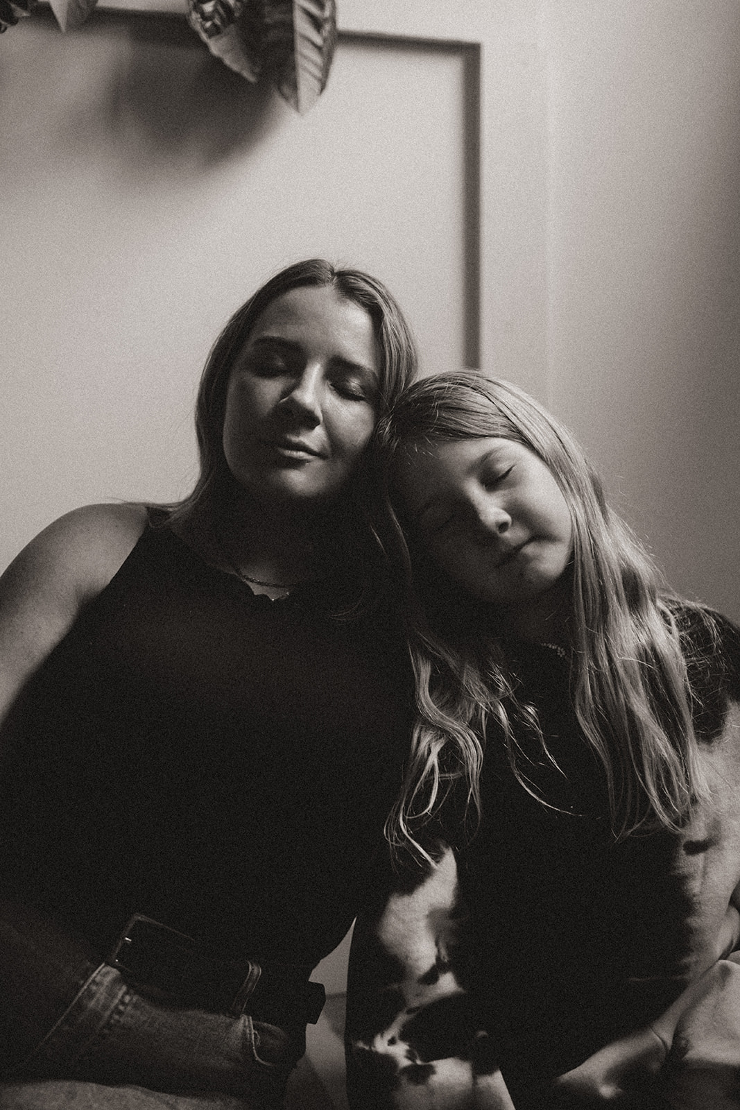 Photographer Chelsea Brown poses with her young daughter in this stunning black and white portrait